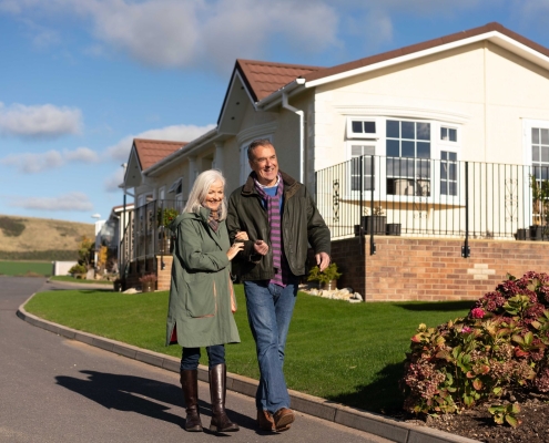 couple walking in residential park home development